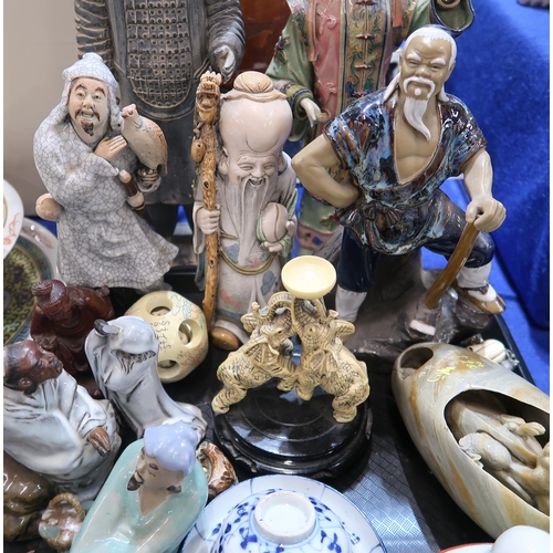 277 - A collection of ceramics including Chinese figures of scholars and fishermen, a Buddha, a carved woo... 