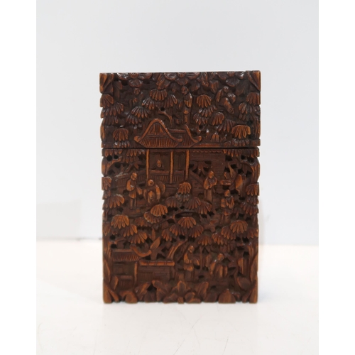 282 - A Chinese carved hardwood case, decorated with figures amongst pavilions, 11.5 x 8cm