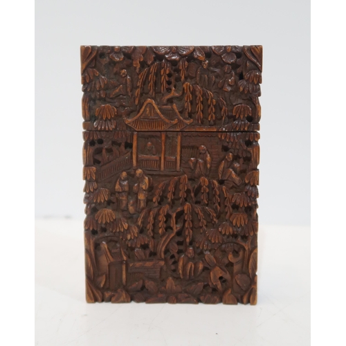 282 - A Chinese carved hardwood case, decorated with figures amongst pavilions, 11.5 x 8cm