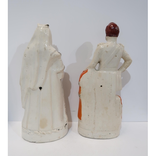 283 - A pair of large Staffordshire flatback figures of Queen Victoria and Prince Albert