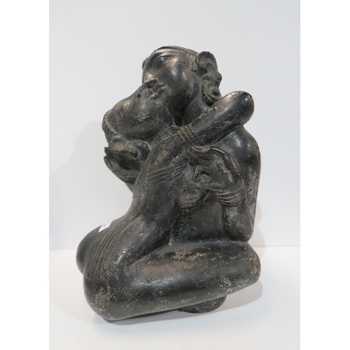 284 - A large Indian figure group of a couple embracing