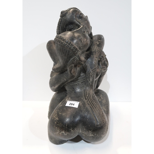 284 - A large Indian figure group of a couple embracing