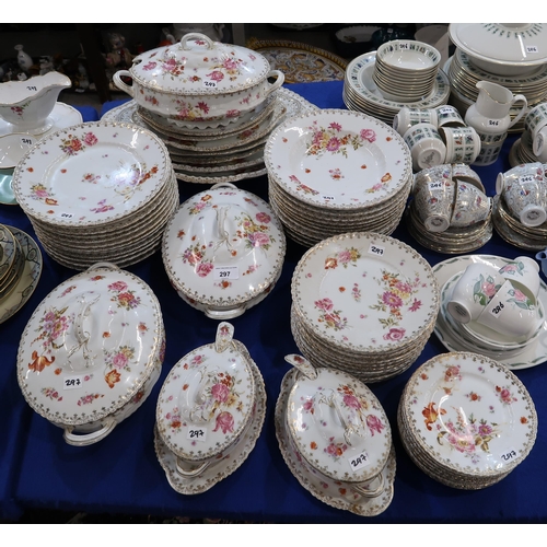 297 - A Victoria porcelain flower decorated dinner service with platters, tureens, dishes, plates etc