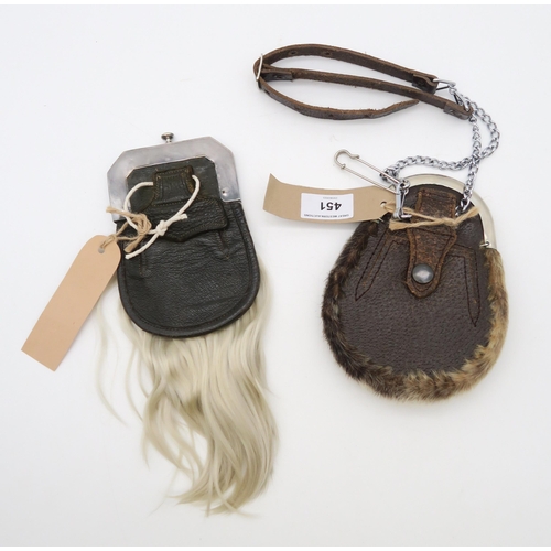 451 - Two early-20th century child's sporrans, one being of horsehair, the white metal cantle embossed wit... 