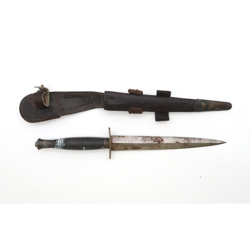 460 - A Fairbairn Sykes 3rd pattern Commando dagger/knife, housed in its metal-mounted leather scabbard, a... 