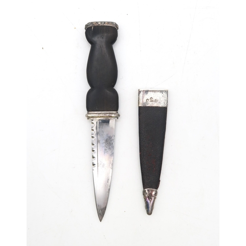 467 - A sealskin sporran, the white metal cantle engraved with Celtic knotwork detail, a further plain bro... 