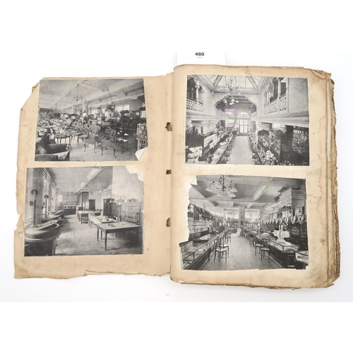 480 - A scrap book, circa 1910, with varied contents to include royalty, seaside postcards, cartoons, phot... 