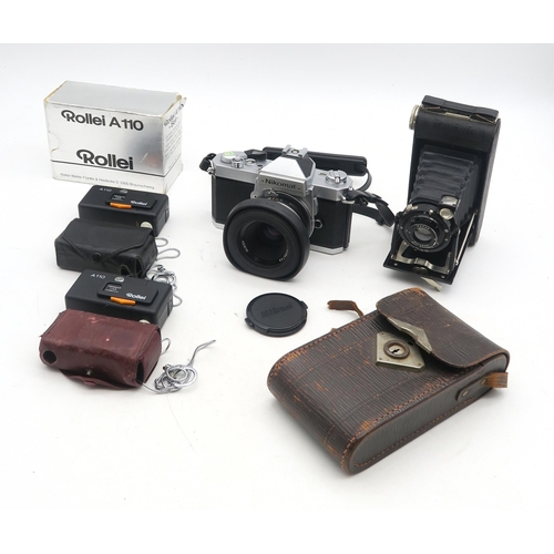 503 - A Japanese Nikomat film camera, fitted with a Nikon Nikkor 50mm 1:2 lens, two Rollei A110 sub-miniat... 