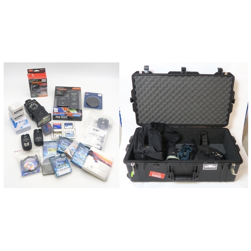 505 - A Peli 1615 Air case, containing a range of camera accessories, including a National PE-3057 flash, ... 