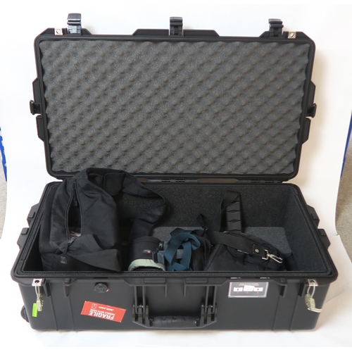 505 - A Peli 1615 Air case, containing a range of camera accessories, including a National PE-3057 flash, ... 