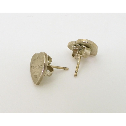 763 - A collection of silver 'Please return to' Jewels, all stamped 'Tiffany & Co, New York', comprisi... 