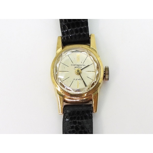 766 - An 18ct gold ladies Continental watch, weight including strap and mechanism 7.9gms