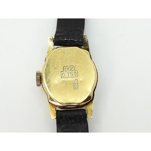 766 - An 18ct gold ladies Continental watch, weight including strap and mechanism 7.9gms