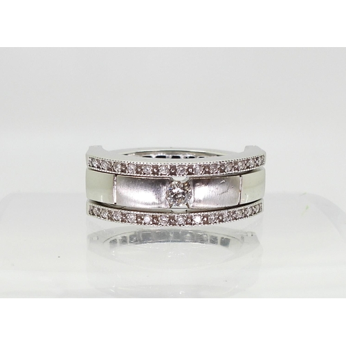 768 - A 14k white gold night & Day ring set with an estimated approx 0.99cts of black & white diam... 