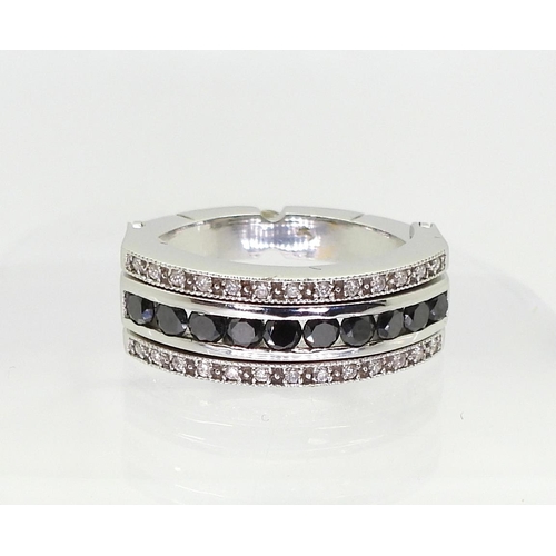 768 - A 14k white gold night & Day ring set with an estimated approx 0.99cts of black & white diam... 