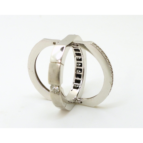 768 - A 14k white gold night & Day ring set with an estimated approx 0.99cts of black & white diam... 