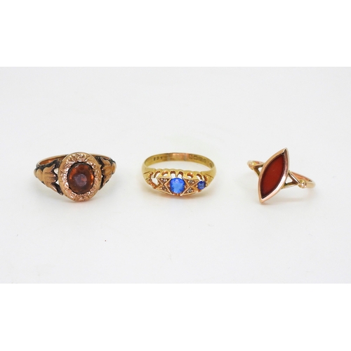 772 - An 18ct (af) gold blue gem and diamond chip ring, size S, weight 2.9gms, a 9ct gold carnelian set ri... 