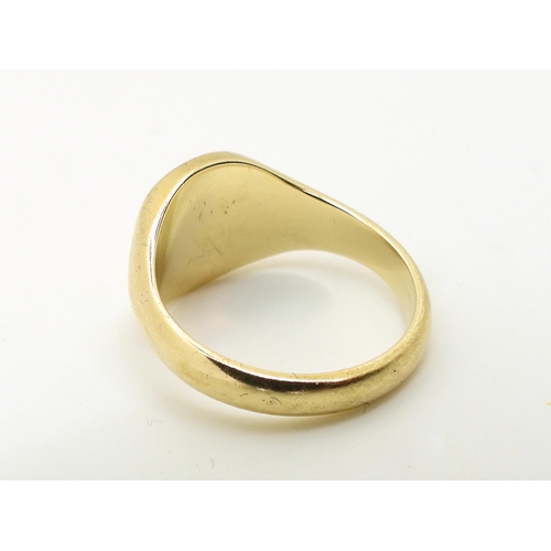 773 - A 9ct gold signet ring, size Q1/2, weight 6.8gms