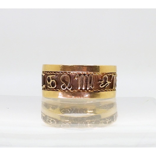 779 - A bright yellow metal band ring, decorated with zodiac signs details, size Q1/2, weight 3.5gms