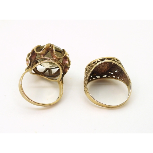 780 - A 9ct gold ring with mounted Smoky quartz, size M, together with a 9ct gold ring, mounted with a fau... 