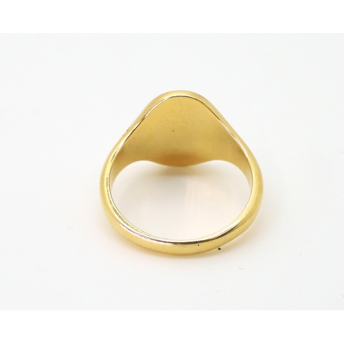 781 - A 18ct gold signet ring marked Birmingham 1963, size U, weight 10.4gms