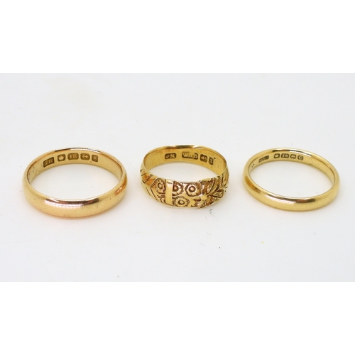 784 - Two 18ct court wedding bands, both stamped Birmingham,stamped SH,1906, size S1/2, the other, 1927, Q... 