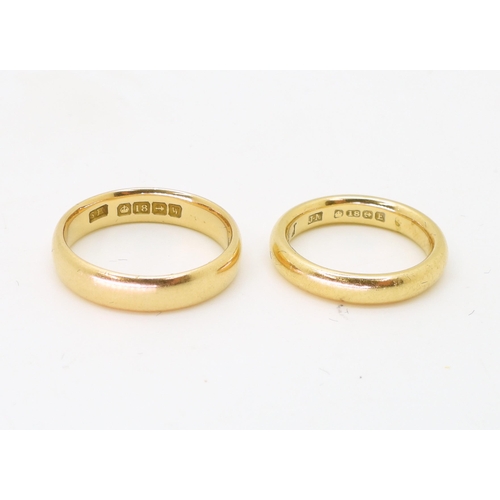 785 - Two 18ct gold court wedding bands, both marked Birmingham, 1921, size O1/2, the other 1929, J1/2, we... 