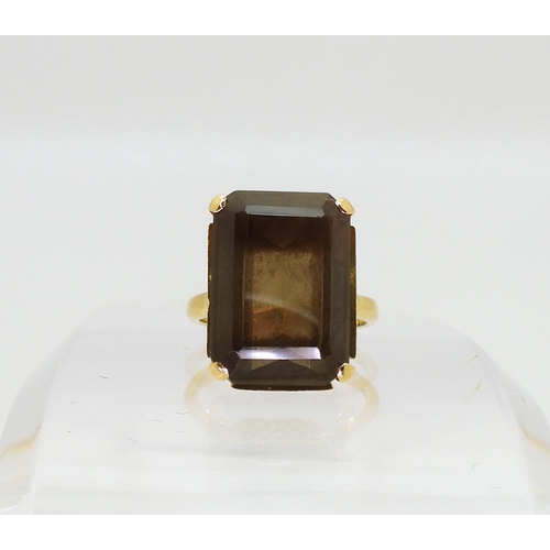 793 - An 18ct gold smoky quartz ring, with a pierced basket setting, size L1/2, weight 8gms