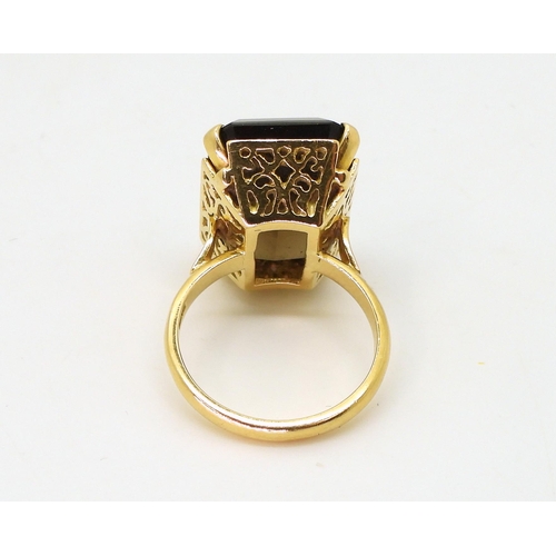 793 - An 18ct gold smoky quartz ring, with a pierced basket setting, size L1/2, weight 8gms