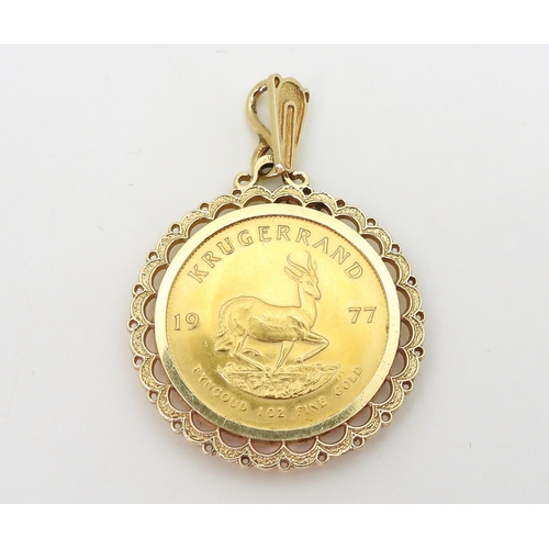 797 - A 1977 1oz fine gold Krugerrand coin in a 14k gold pendant mount, weight together 43.4gms