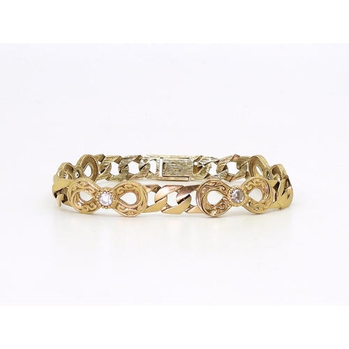 800 - A 9ct gold clear gem set curb link bracelet, length approx 18cm, weight 15.6gms