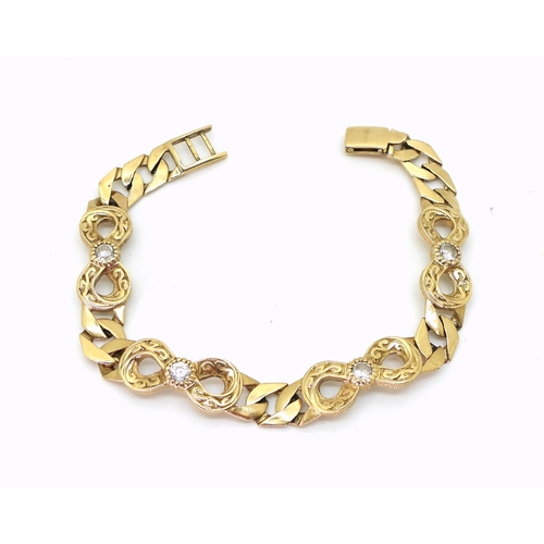 800 - A 9ct gold clear gem set curb link bracelet, length approx 18cm, weight 15.6gms