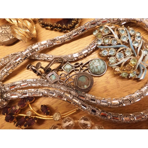 862 - A large box full of costume jewellery to include a long string of crystal beads, vintage brooches et... 