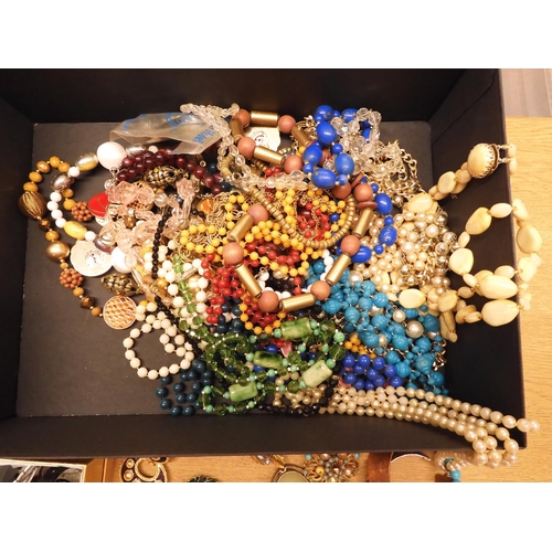 862 - A large box full of costume jewellery to include a long string of crystal beads, vintage brooches et... 