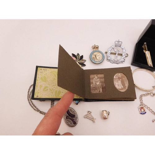 870 - A silver mounted early 20th century mini photo album, A Royal Observer Corps Sweetheart brooch and c... 