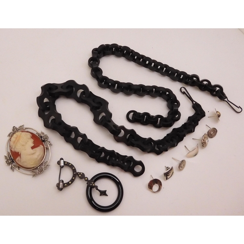 875 - Two Vulcanite Victorian mourning fob watch chains, a silver and black glass, marcasite brooch etc