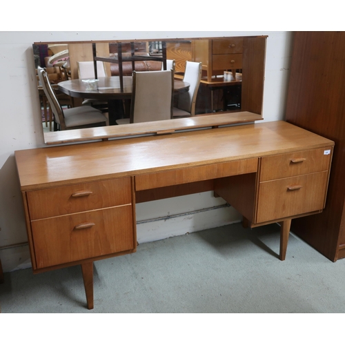 106 - A mid 20th century teak Beithcraft mirror back dressing table, 118cm high x 152cm wide x 52cm deep