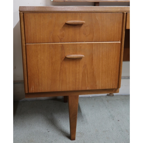 106 - A mid 20th century teak Beithcraft mirror back dressing table, 118cm high x 152cm wide x 52cm deep