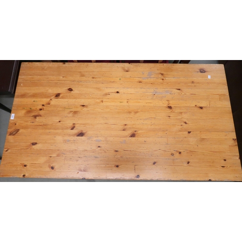 115 - A contemporary pine topped work table on metallic supports, 71cm high x 153cm long x 83cm deep