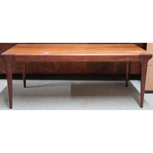 116 - A mid 20th century teak coffee table with rectangular top on shaped tapering supports, 42cm high x 1... 