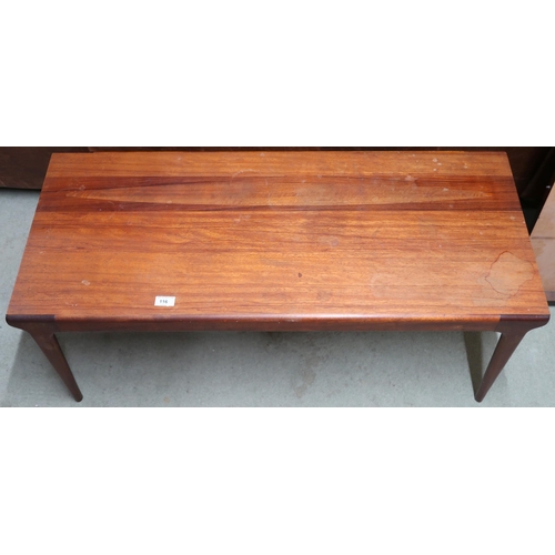 116 - A mid 20th century teak coffee table with rectangular top on shaped tapering supports, 42cm high x 1... 