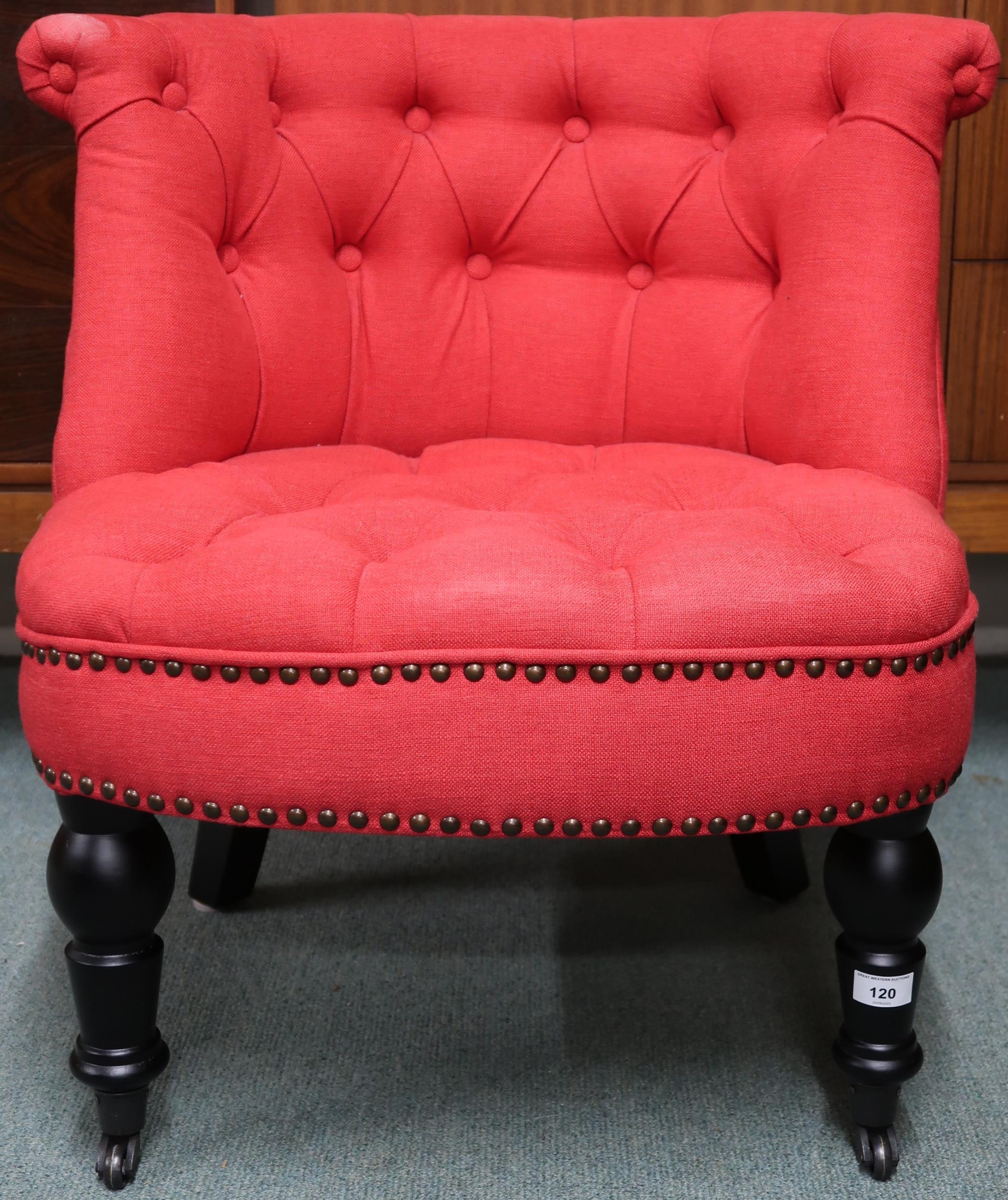 A contemporary Tudor red fabric button back upholstered