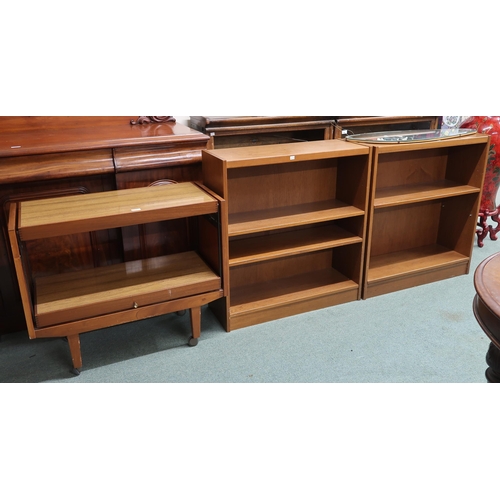 121 - A lot comprising pair of mid 20th century teak bookcases, a teak two tier metamorphic tea trolley an... 