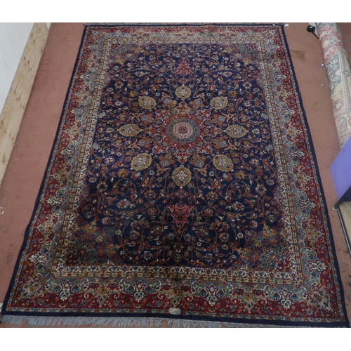 122 - A blue ground Tabriz rug with central sun burst medallion on floral patterned ground with light blue... 