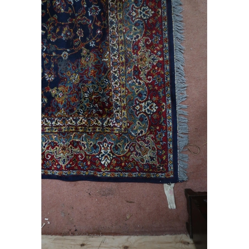 122 - A blue ground Tabriz rug with central sun burst medallion on floral patterned ground with light blue... 