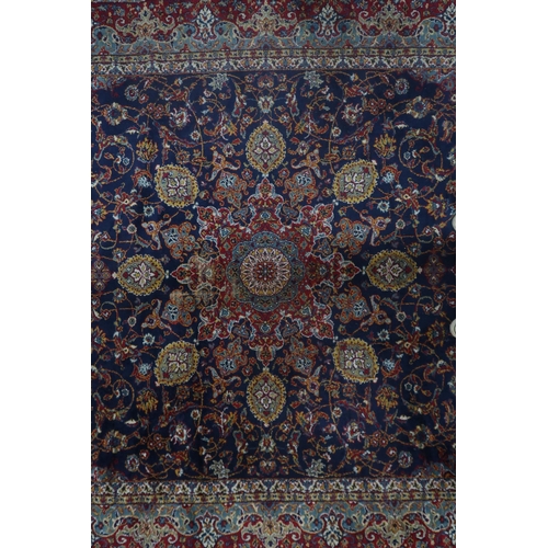 122 - A blue ground Tabriz rug with central sun burst medallion on floral patterned ground with light blue... 