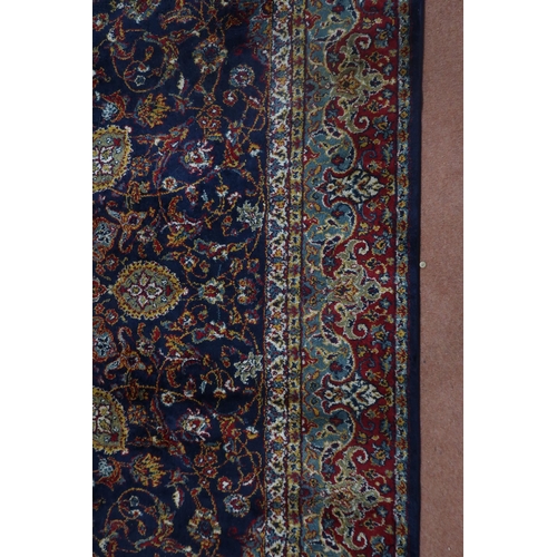 122 - A blue ground Tabriz rug with central sun burst medallion on floral patterned ground with light blue... 