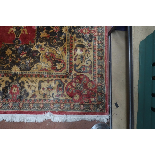 123 - A red ground Keshan rug with cream central medallion, matching spandrels and borders, 353cm long x 2... 