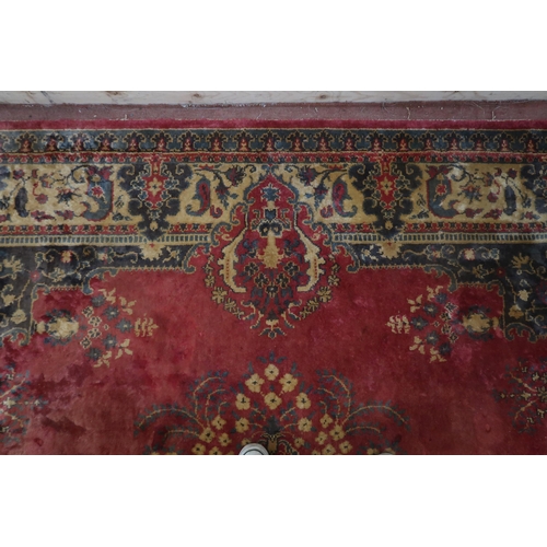 123 - A red ground Keshan rug with cream central medallion, matching spandrels and borders, 353cm long x 2... 