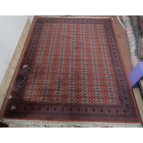 124 - A pair of terracotta ground Bokhara rugs with all over lozenge design and multicoloured border, 364c... 